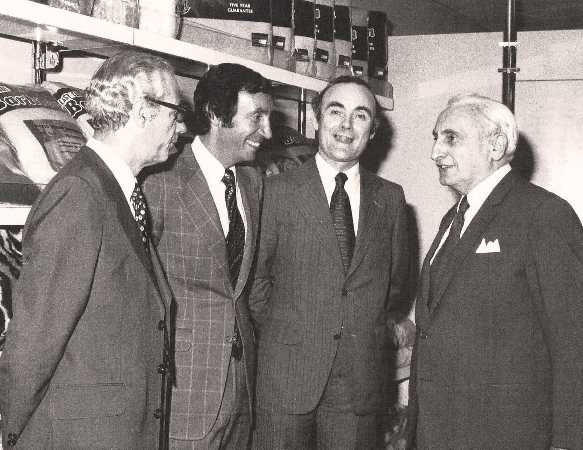 Far Right Maurice Phillips (Founder); Middle Right, Selfridges Buyer; Middle Left, Malcolm Phillips (2nd Generation); Far Left, Phillip Dew (An employee of the Original Maurice Phillips Company) Photo Taken 1982.