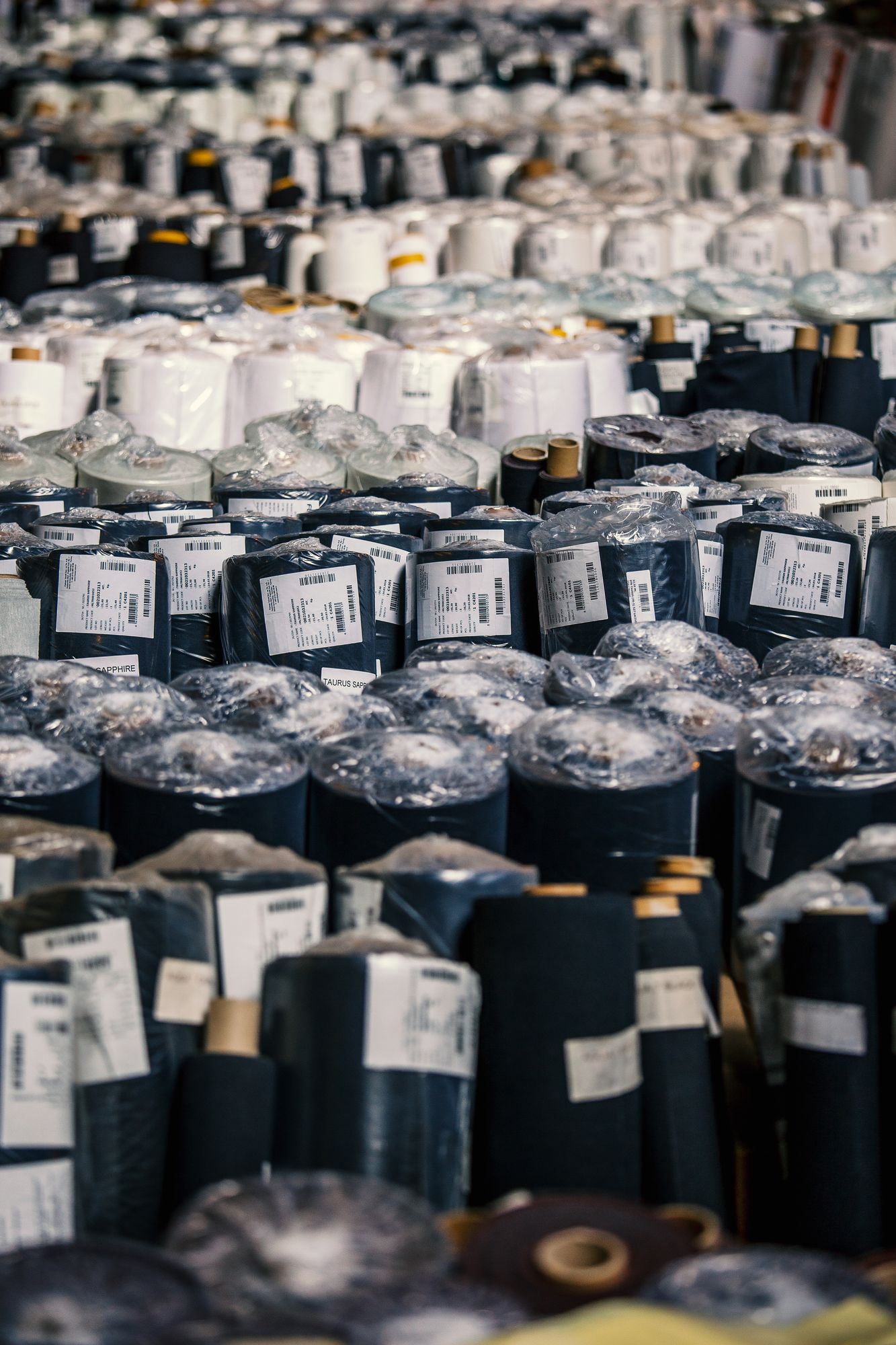 Rolls of fabric at Agua warehouse in Romford Essex.